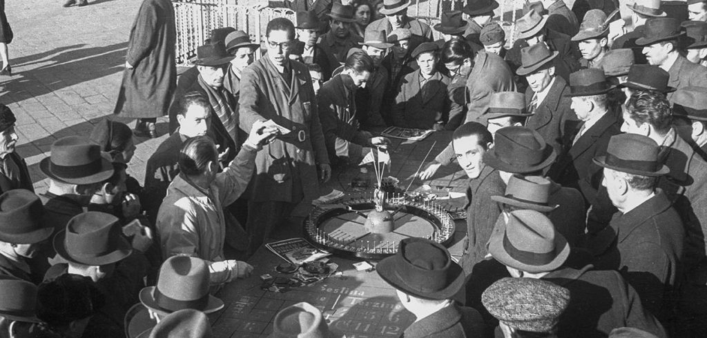Black and white photo of roulette being played. 